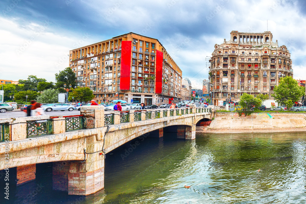 Antique building view in Old Town Bucharest city - capital of Romania and Dambrovita river