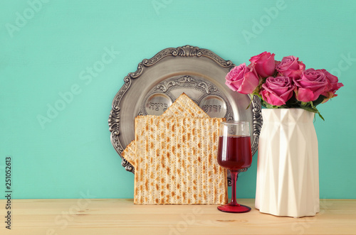 Pesah celebration concept (jewish Passover holiday) over wooden table