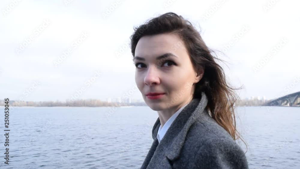 Portrait of a young woman with beautiful hair near the river. Portrait of a young woman with beautiful hair near the river.
