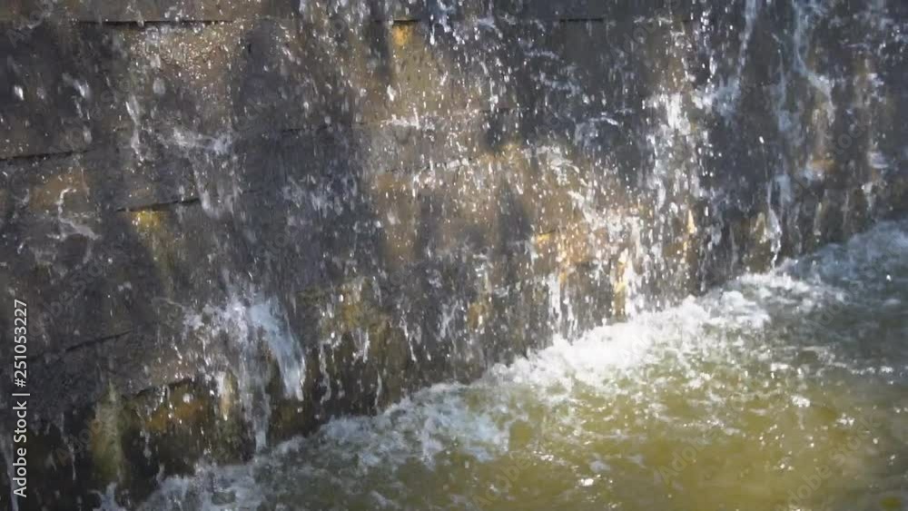 Small waterfall from fountain close up. slow motion. Small waterfall from fountain close up. slow motion.