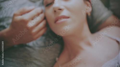 Happy morning of Young romantic couple in love have fun, kissing and hugs in bedroom . Love and relationships lifestyle, interior loft bedroom.