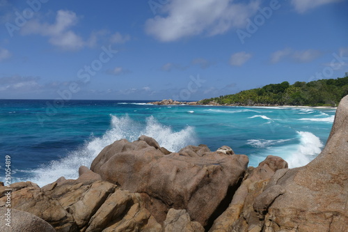 waves breaking on the rocks in seychelles