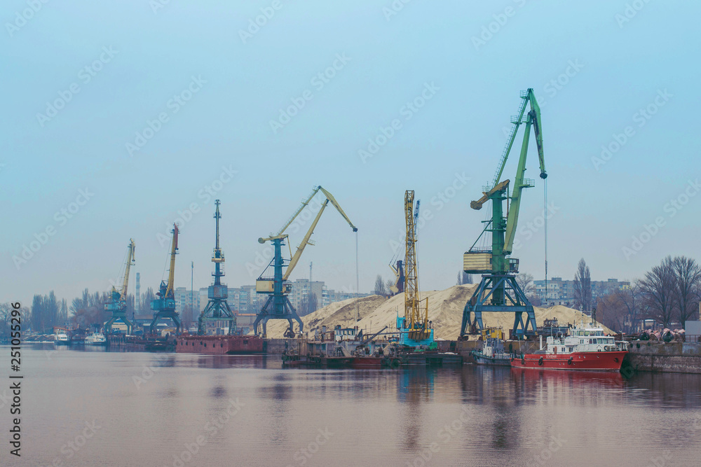 Cargo dock ship-lifting cranes in the harbor, Cargo river port terminal container