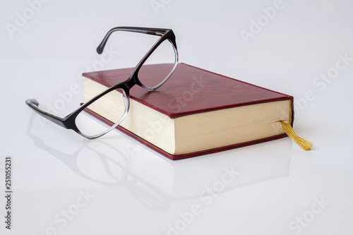 Stylish glasses for women with monofocal lenses and book photo