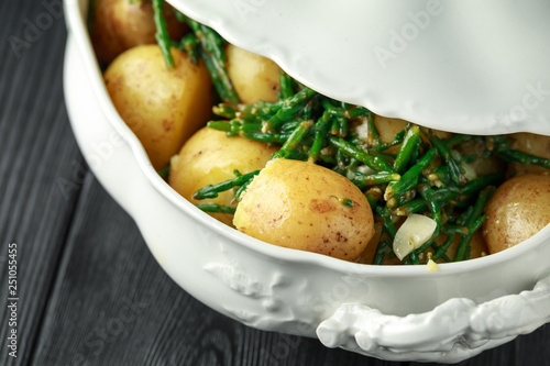 Boiled new potato with fresh samphire and garlic photo