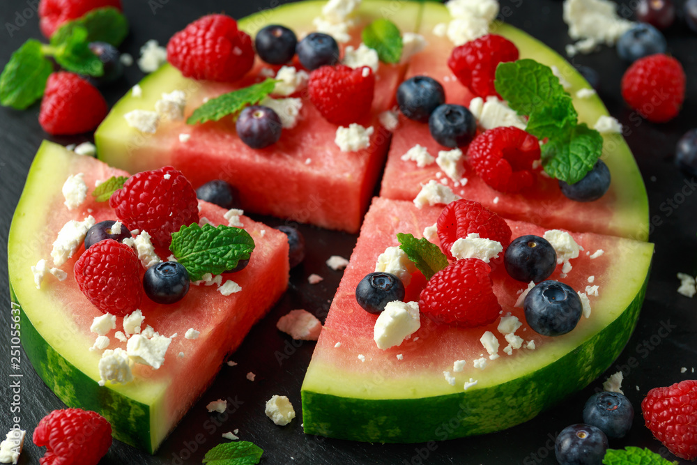 Juicy watermelon pizza with blueberries, raspberry feta cheese, mint. party food