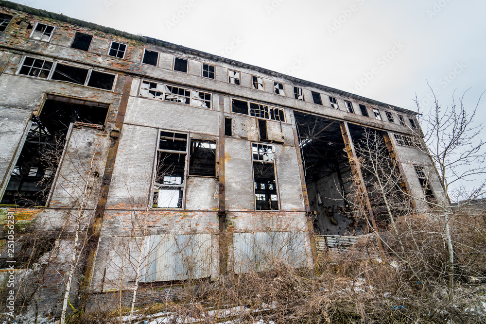 Abandoned industrial building. Ruins of an old factory Abandoned industrial building. Ruins of an old factory