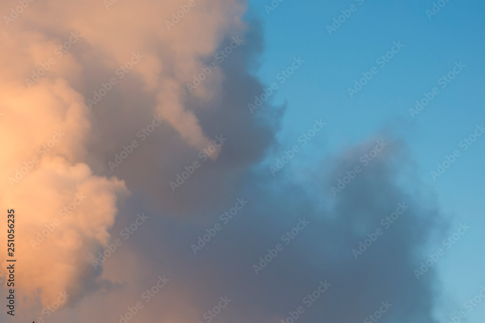Smoke, clouds in the blue sky. Abstract background for design and project. Concept: ecology, weather