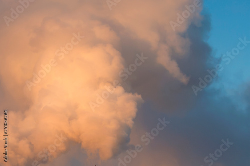 Smoke, clouds in the blue sky. Abstract background for design and project. Concept: ecology, weather