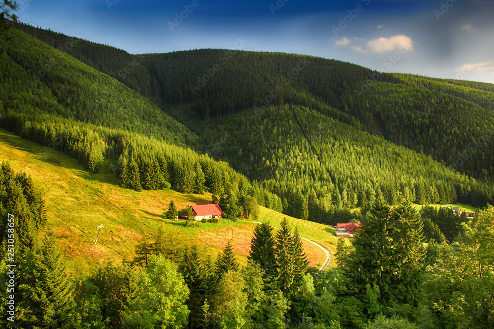Obraz premium Valley in czech national park Giant mountain- Krkonose. The town with a lot of wooden huts in Spindleruv Mlyn. Czech nature is beautiful.