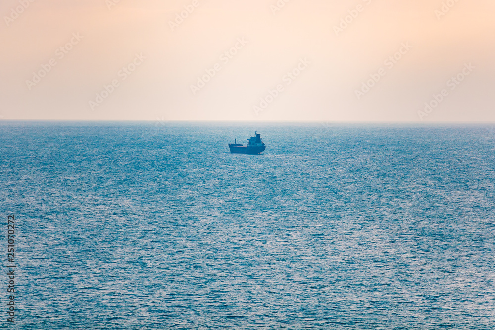 Obraz premium Shipping concept. Single tanker transporting goods in sea