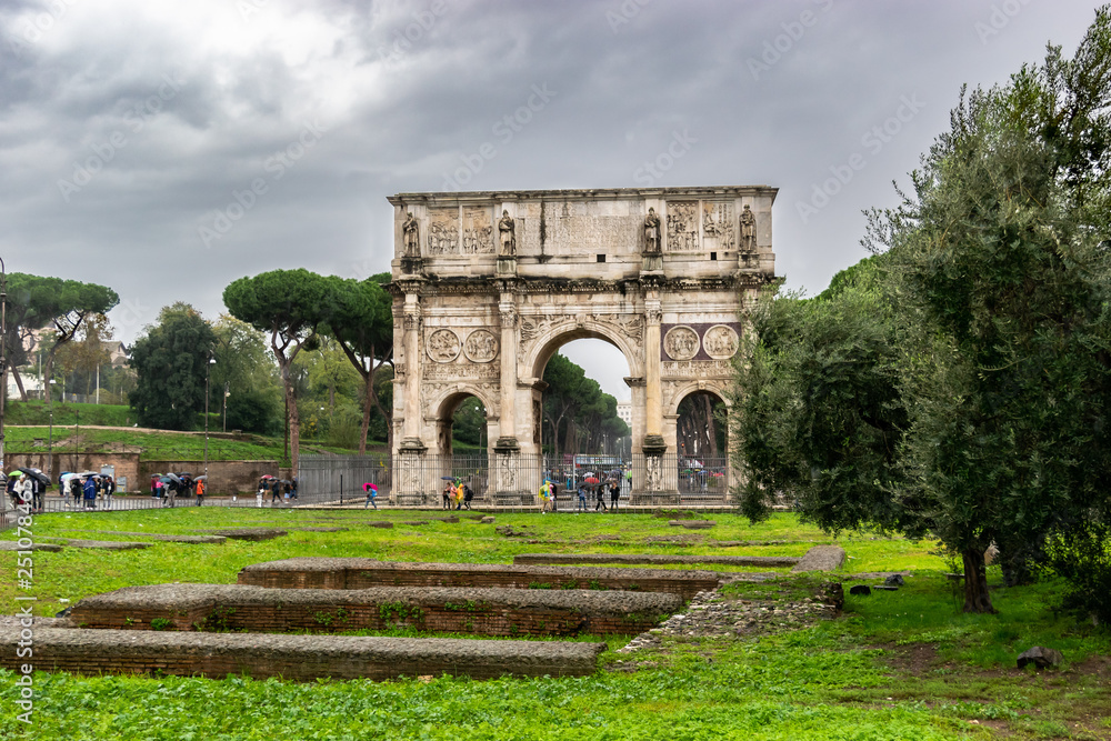 Fototapeta premium The Arch of Constantine, a triumphal arch in Rome situated between the Colosseum and the Palatine Hill erected by the Roman Senate in the year 312