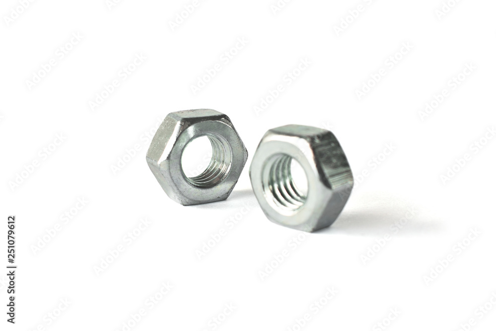 Closeup of nuts isolated on white. Self Drilling screws. Isolated fasteners. Connecting material on white background Closeup of nuts isolated on white. Self Drilling screws. Isolated fasteners. Connecting material on white background