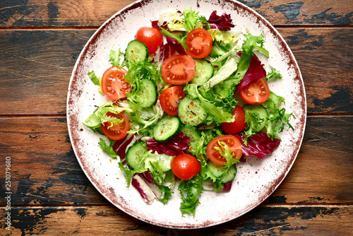 Wallpaper Mural Vegetable salad with tomato and cucumber.Top view with copy space. Torontodigital.ca