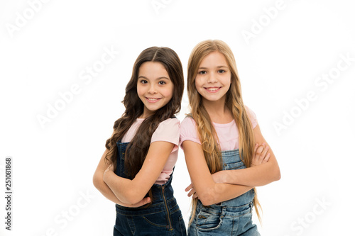 Hair like this is the focus of their look. Beauty and hair salon. Cute little girls wearing new hairstyle. Small girls with long hairstyle. Kids hair grooming. Natural hair styling and dressing