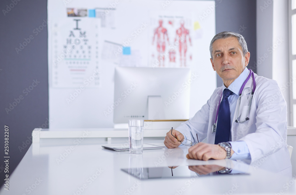 Portrait of a smiling doctor in his bright office Portrait of a smiling doctor in his bright office