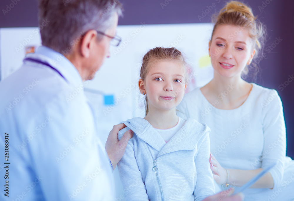 Fototapeta premium Little girl with her mother at a doctor on consultation