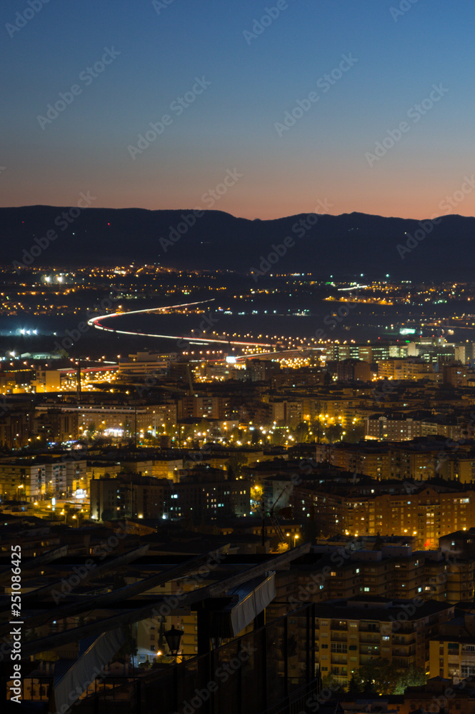 Afterglow with Cityscape and Mountains at Mirador del Barranco del Abogado Lookout in Granada, Spain