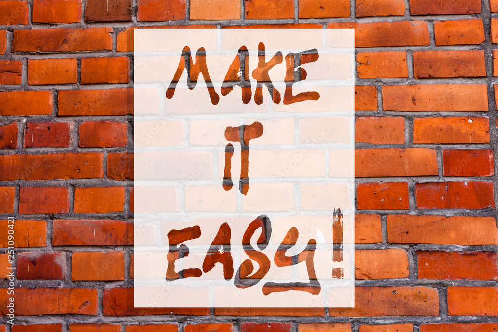 Obraz premium Handwriting text writing Make It Easy. Concept meaning Smart approach Effortless Free from worries or difficulties Brick Wall art like Graffiti motivational call written on the wall