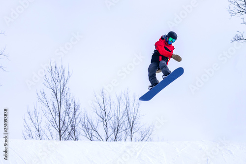 People are enjoying downhill skiing and snowboarding