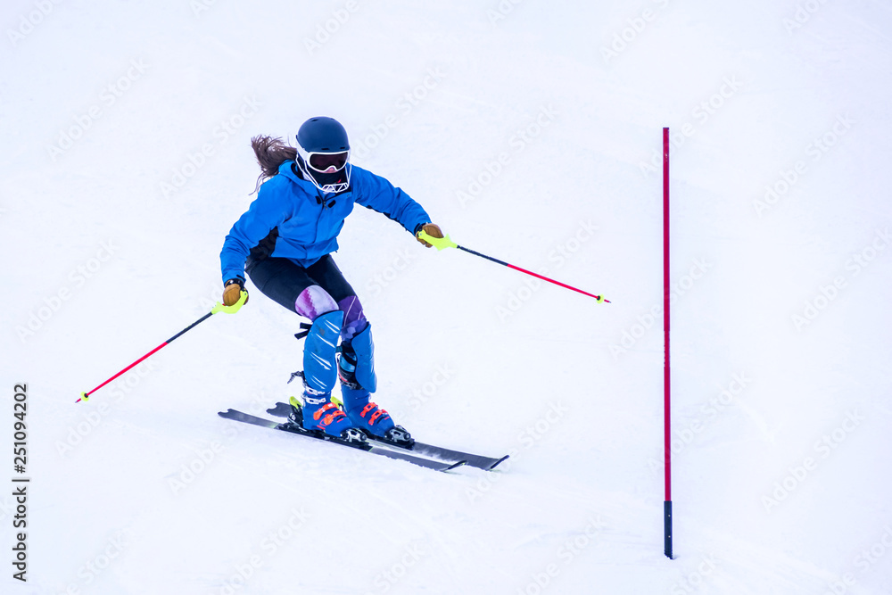 People are enjoying downhill skiing and snowboarding People are enjoying downhill skiing and snowboarding