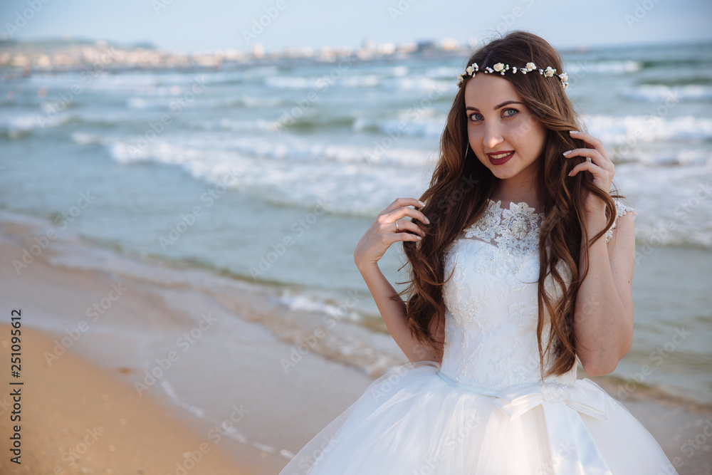 Portrait of beautiful bride with wedding makeup, hairstyle and jewelry wreath on long curly hair. Portrait of beautiful bride with wedding makeup, hairstyle and jewelry wreath on long curly hair.