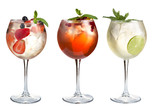 Alcoholic and non-alcoholic cocktails with mint, fruits and berries on a white background. Three cocktails in glass glasses on a long leg.