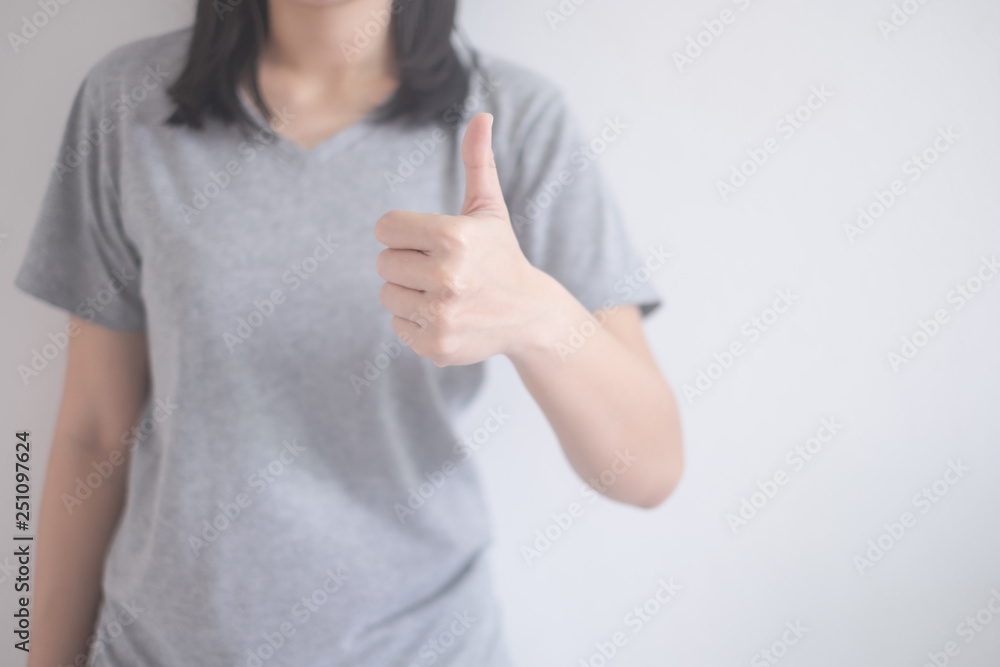 beautiful Asian woman showing thumbs up isolated on a white background with copy space beautiful Asian woman showing thumbs up isolated on a white background with copy space