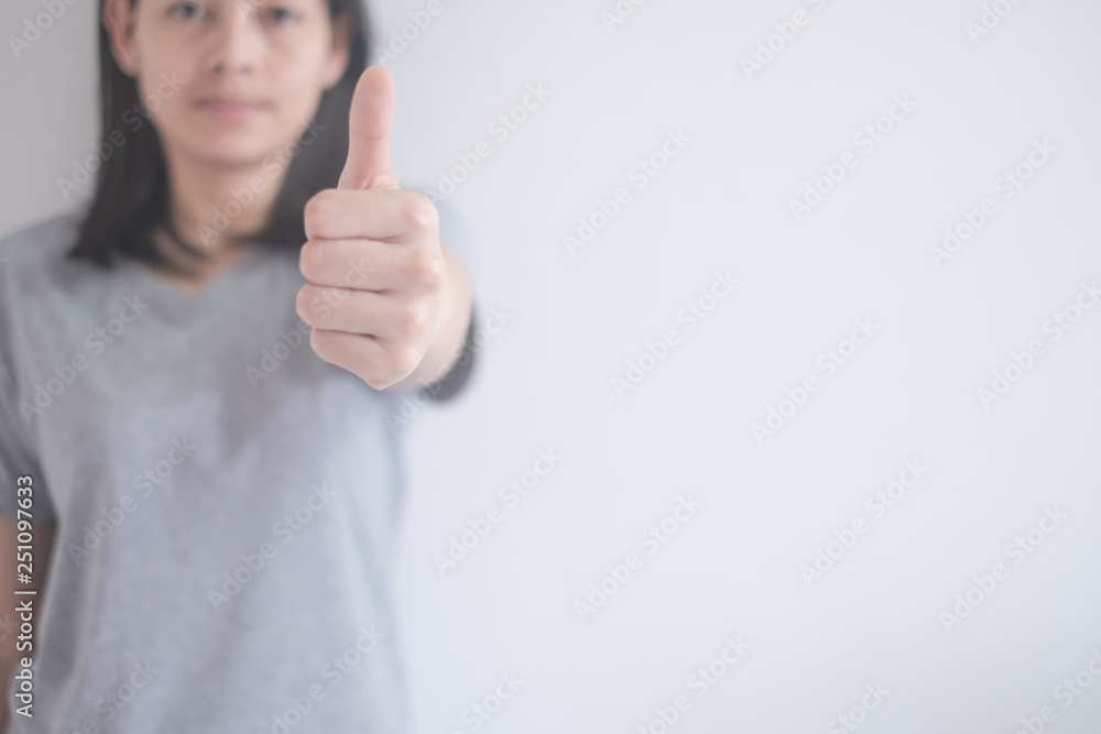 beautiful Asian woman showing thumbs up isolated on a white background with copy space beautiful Asian woman showing thumbs up isolated on a white background with copy space