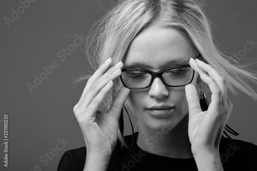 Beautiful half face of a woman with glasses black and white photo photo