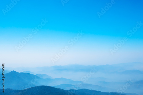 The mountains and forests with blue sky and white clouds at the peak of Inthanon national park (park name) in Chiang Mai province , Thailand in a foggy or misty day , real photo not graphic program.   © guidenuk