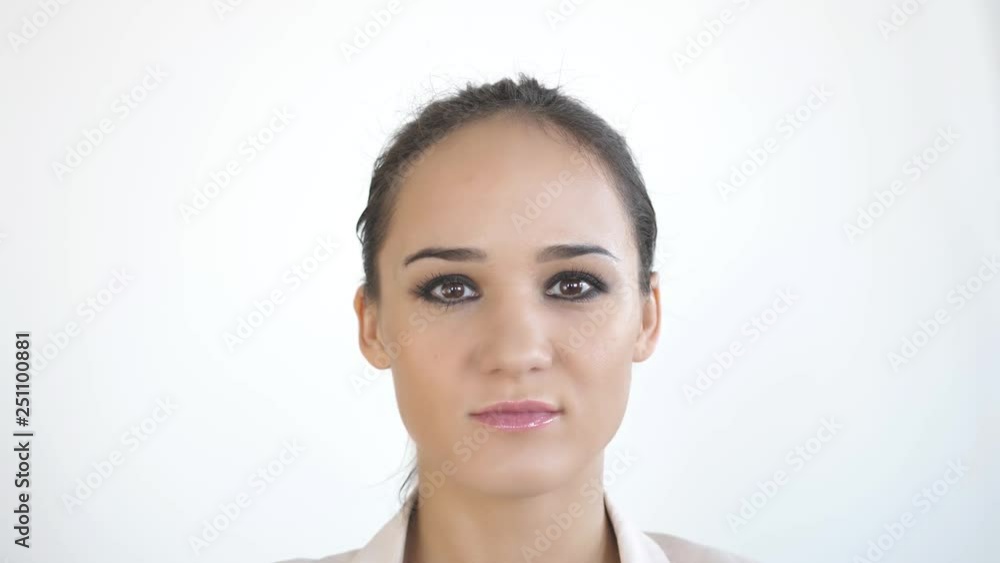 Close up portrait of young caucasian woman on a white background. slow motion. skincare concept. 3840x2160 Close up portrait of young caucasian woman on a white background. slow motion. skincare concept. 3840x2160
