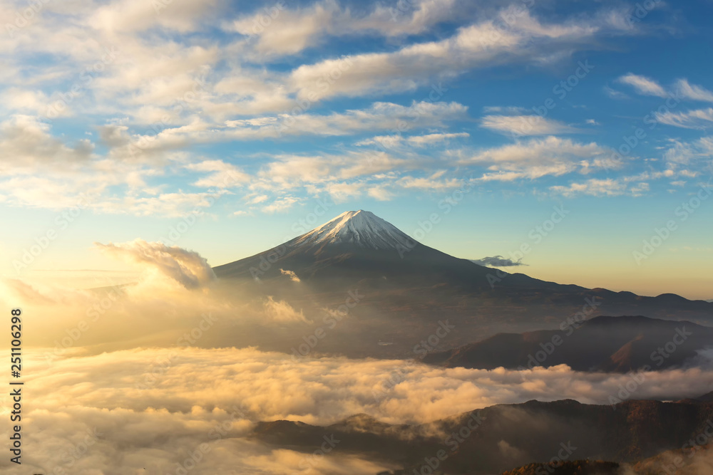 Fuji mountain and the mist over Lake Kawaguchiko at beautiful sunrise , Yamanashi, Japan, Mount Fuji or Fujisan located on Honshu Island, is the highest mountain in Japan.