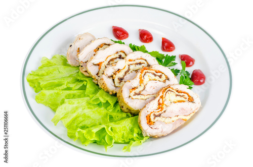 Plate of lettuce and slices of chicken roll.