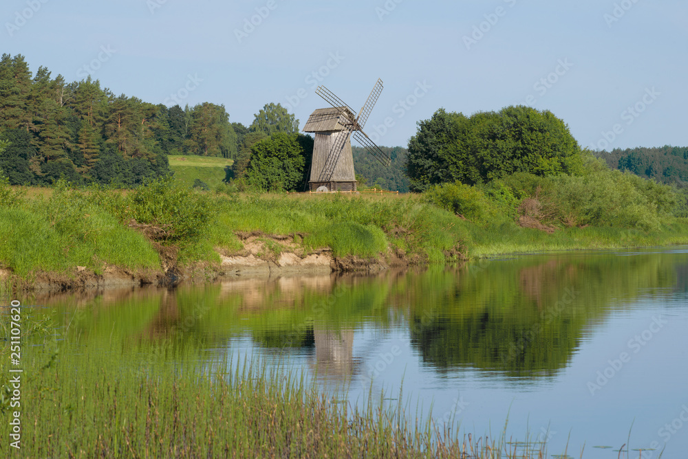 Old windmill on the bank of the river Sorot on the morning of June. Mikhailovskoe, Pushkin Mountains