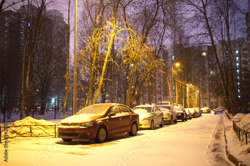 Snow covered roads in the city block at night