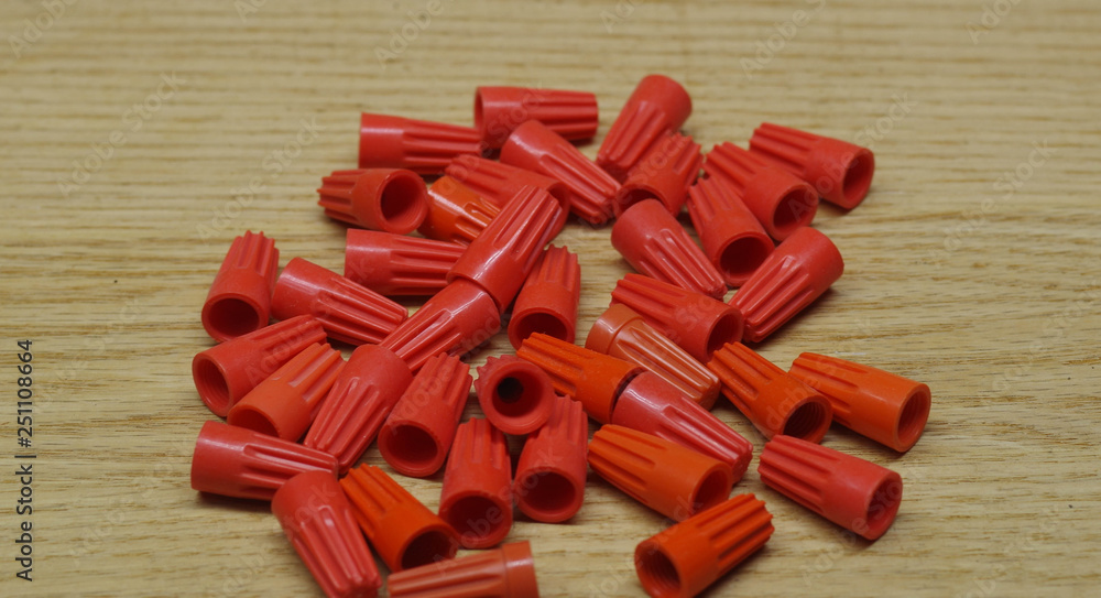 Orange wire nuts typically used to connect switches for lighting or fans Orange wire nuts typically used to connect switches for lighting or fans