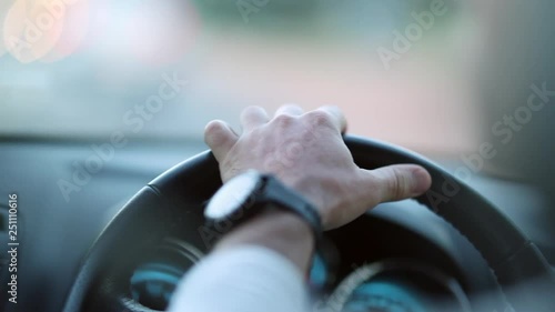 Hands holding steering wheel driving photo