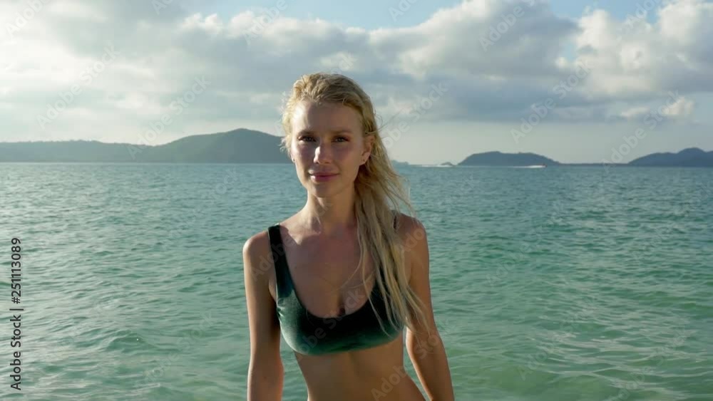 Stunning fit model with belly piercing wearing green bikini Stunning fit model with belly piercing wearing green bikini