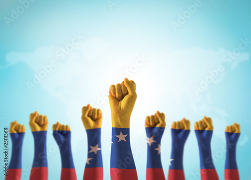 Venezuela flag on people fist hands (isolated with clipping path) for national empowerment and holiday celebration  photo