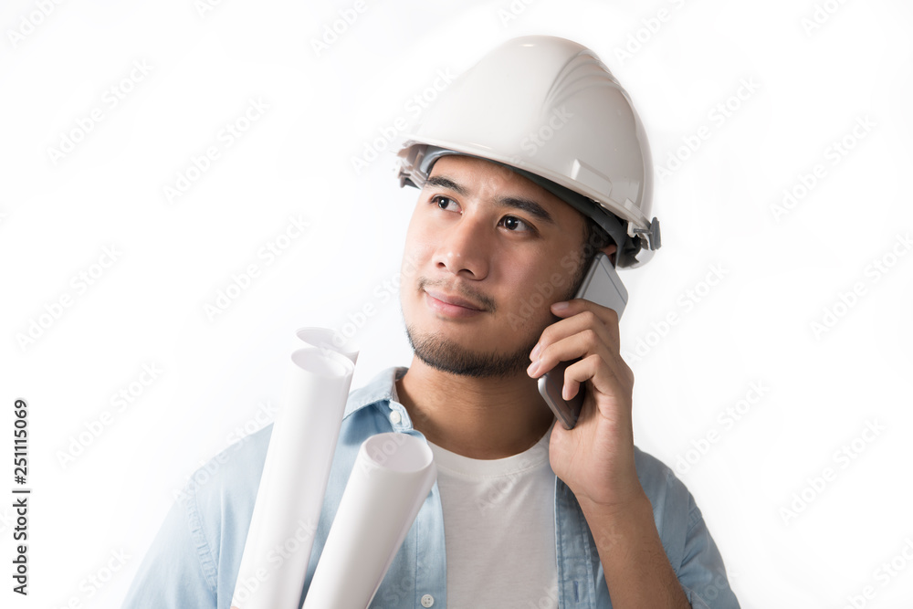 Portrait of asian engineer holding blueprint and using a cellphone isolated on white background Portrait of asian engineer holding blueprint and using a cellphone isolated on white background