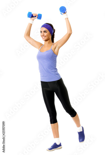 woman in violet sportswear, doing fitness exercise with dumbbells