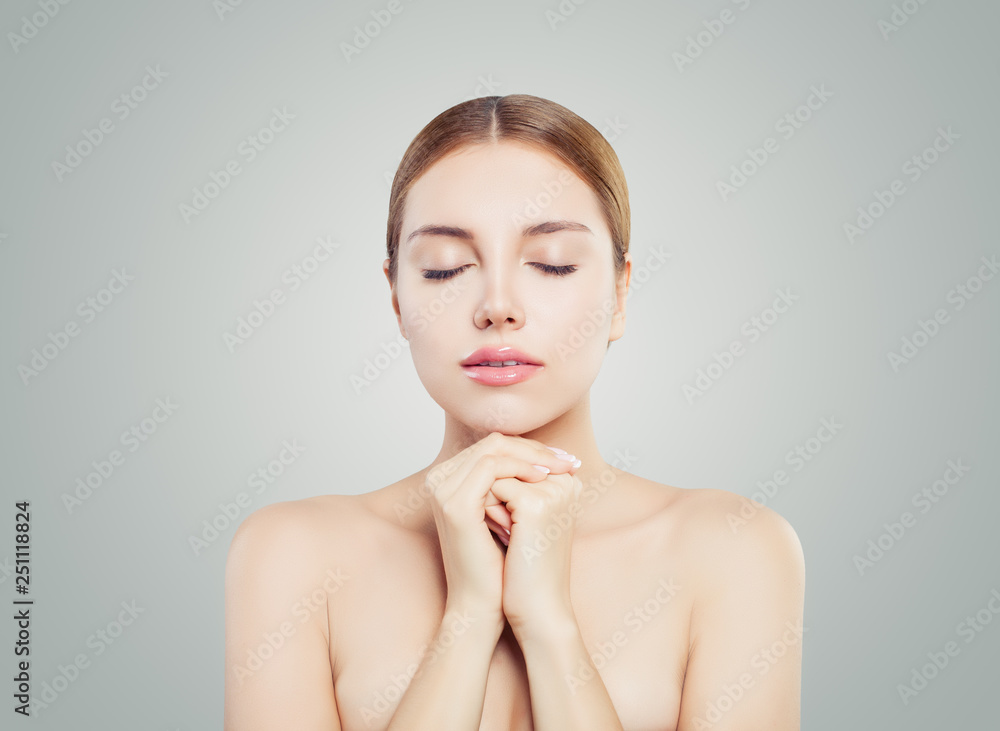 Woman face. Smiling girl with clear skin relaxing. Facial treatment, skincare and cosmetology concept Woman face. Smiling girl with clear skin relaxing. Facial treatment, skincare and cosmetology concept
