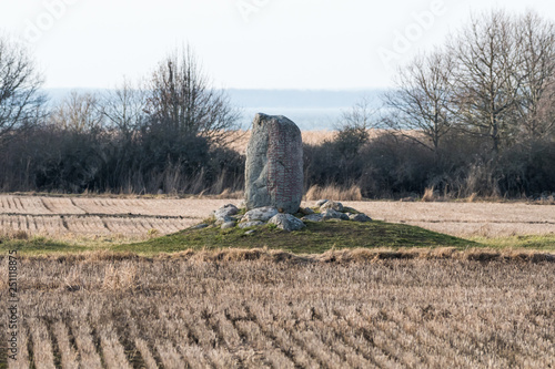 Standing stone with runes photo