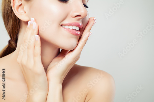 Tela Healthy woman lips with glossy pink makeup and manicured hands with french manic