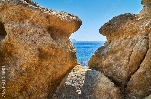 Sandstone boulders on the beach photo