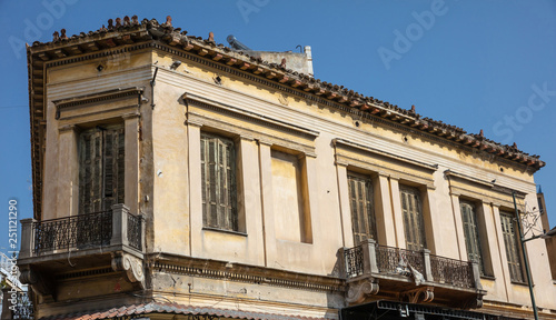 Ruined facade of an abandoned building in Monastiraki, Athens, Greece