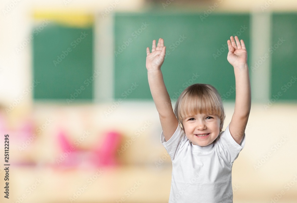 Pupil raising arm during the lesson, Education Pupil raising arm during the lesson, Education