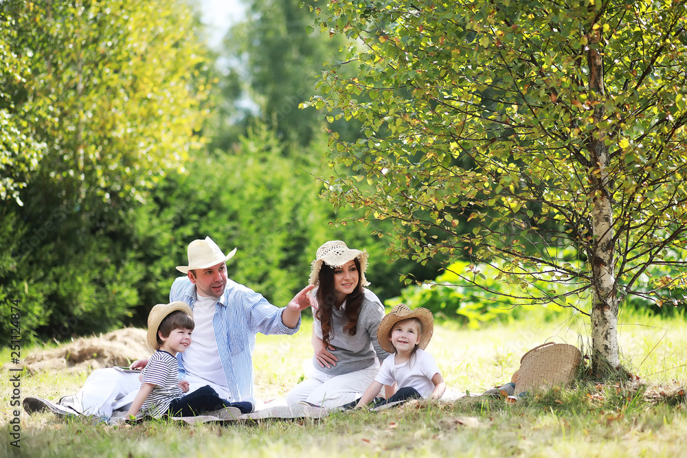 Family with children eating watermelon on the nature in campaign. Family with children eating watermelon on the nature in campaign.