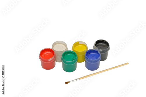 Colored gouache paints and paint brush isolated on white background